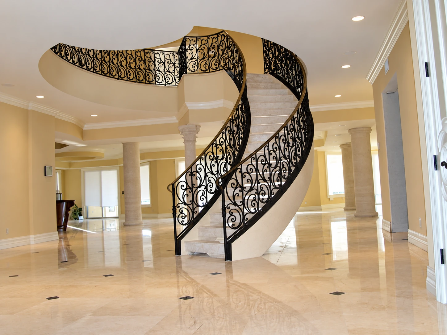 Decorative metal railing on a curved interior staircase